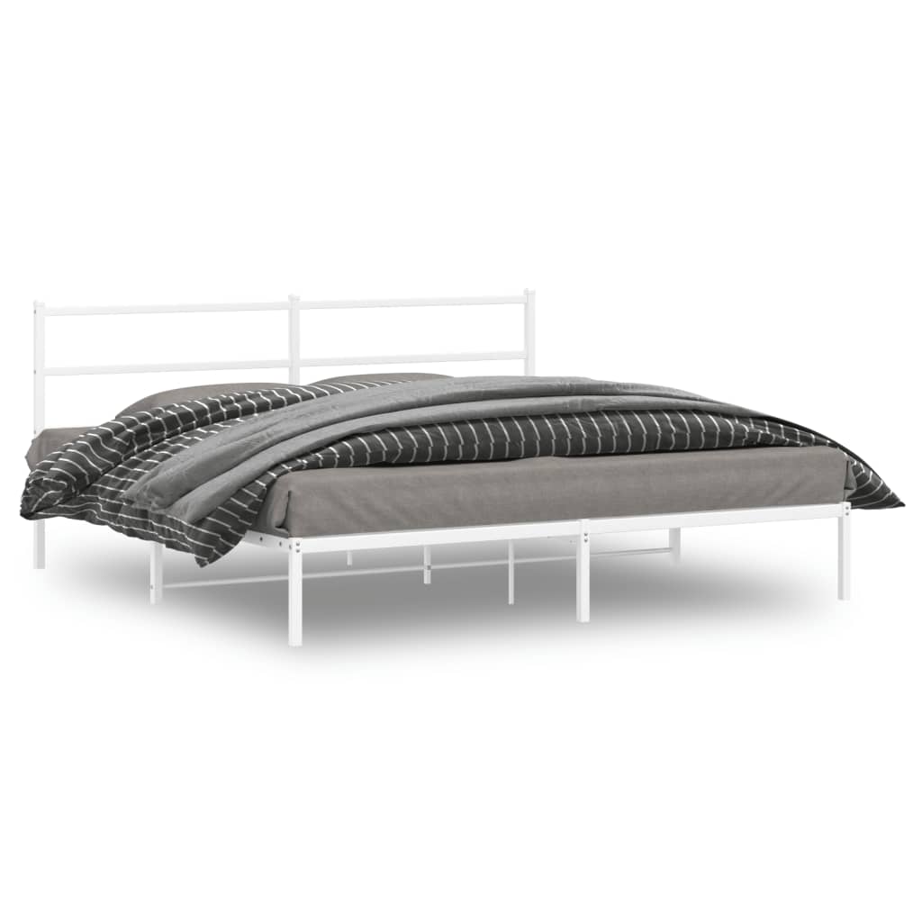 White metal bed frame with grey and striped bedding