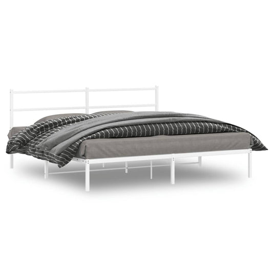 White metal bed frame with grey and striped bedding