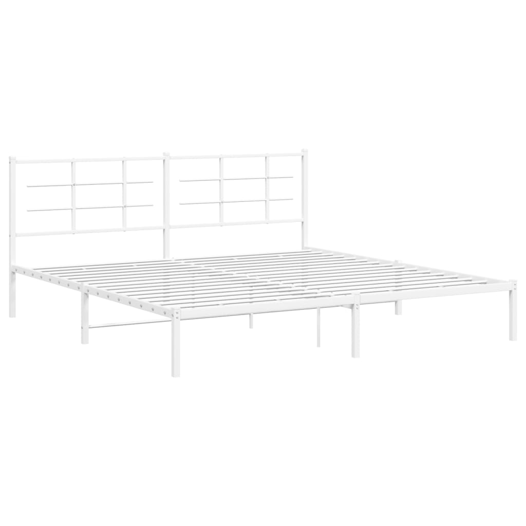 White metal bed frame with two separate headboards and grey bedding