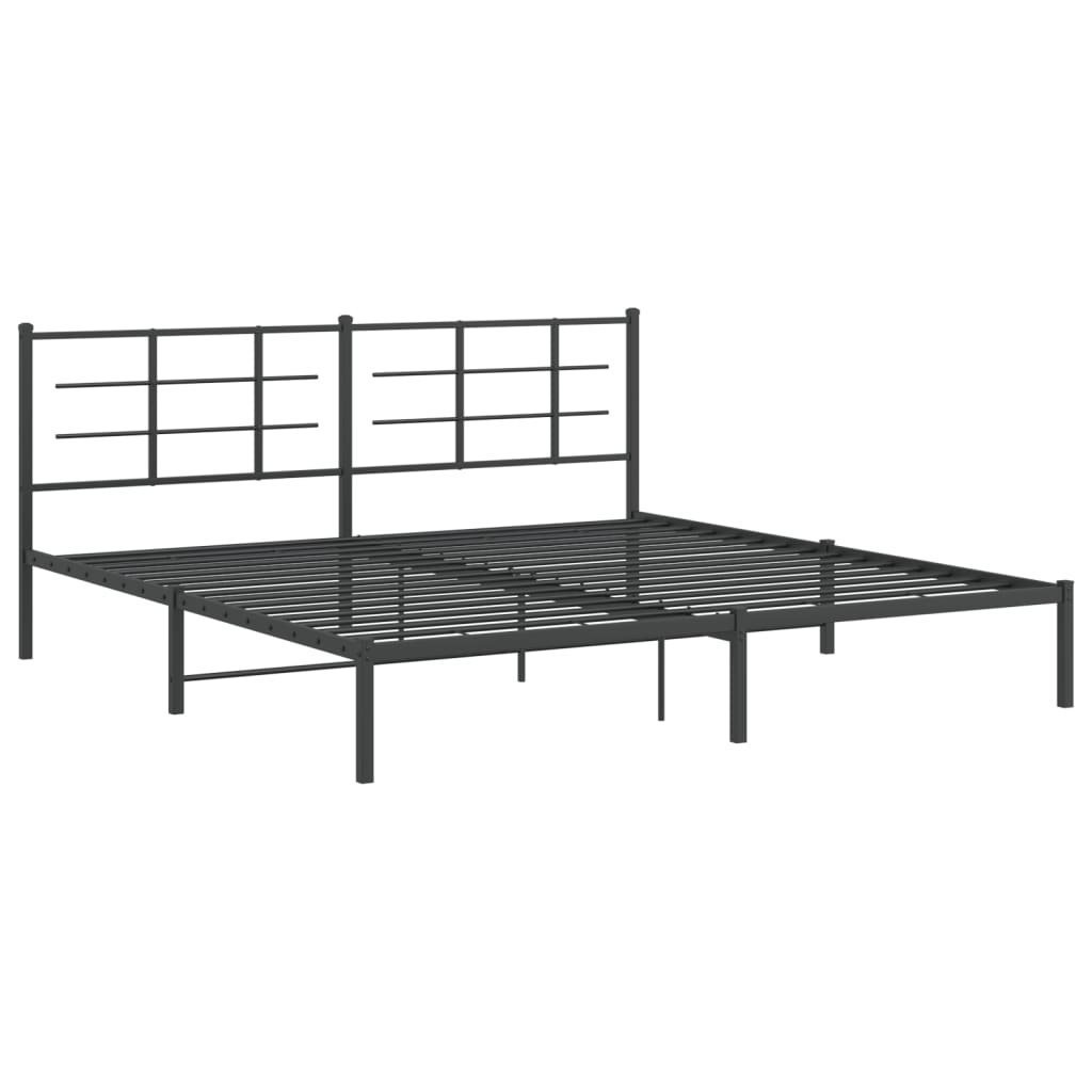Black metal bed frame with a minimalist grid headboard and striped bedding