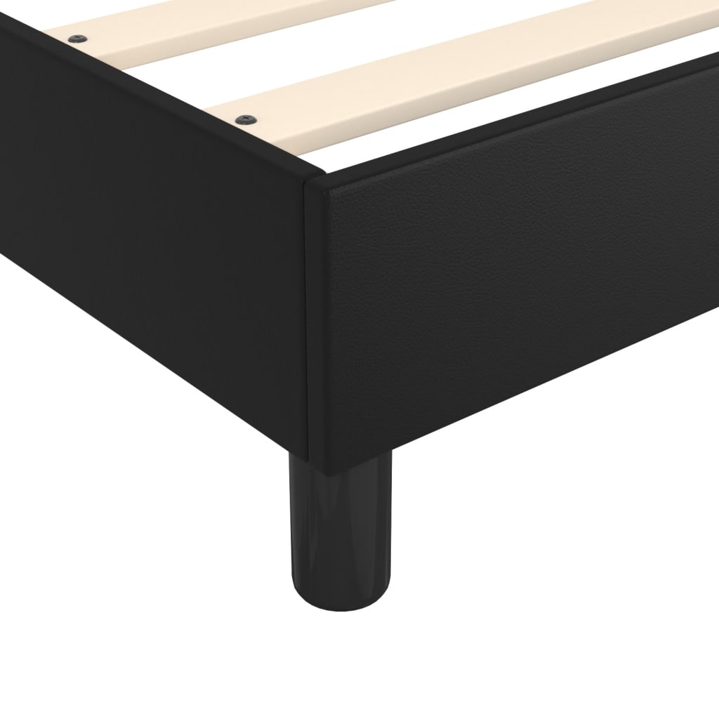 Black upholstered platform bed frame with wooden slats