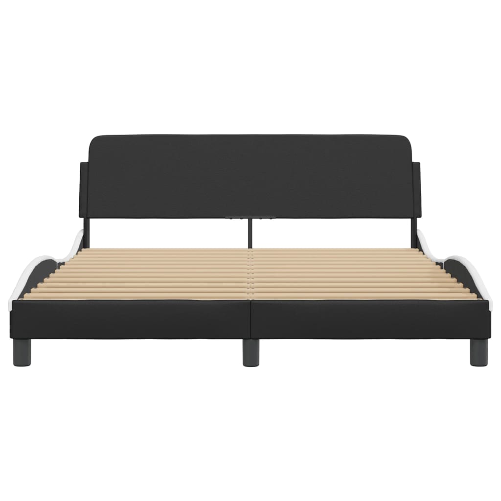 Black upholstered bed frame with a curved white trim and wooden slats