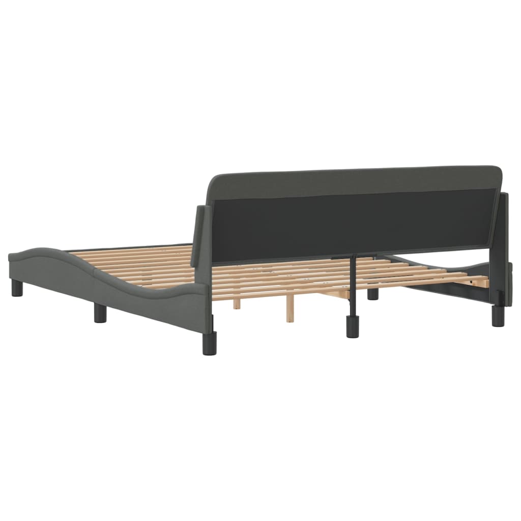 Dark gray upholstered bed frame with slatted base