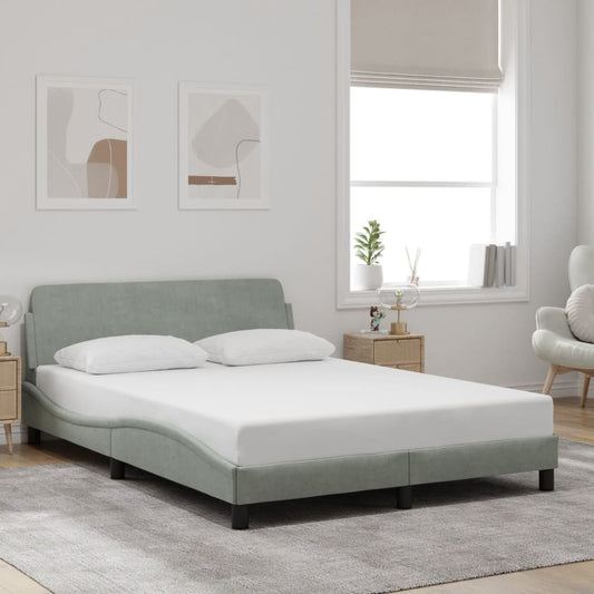 Light green upholstered bed frame with curved headboard and low profile