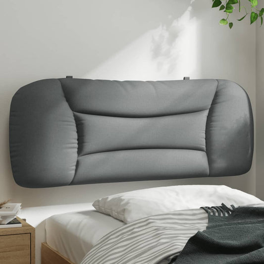 Tufted gray upholstered headboard mounted above a bed