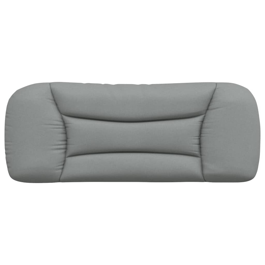 Gray upholstered wallmounted headboard with a curved design