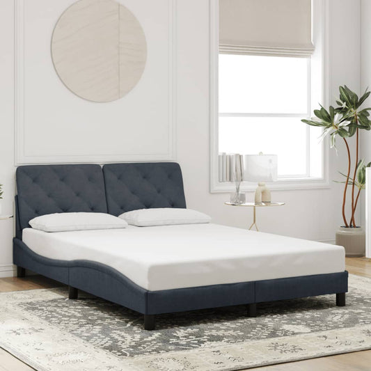 Modern upholstered bed frame in navy blue fabric with tufted headboard