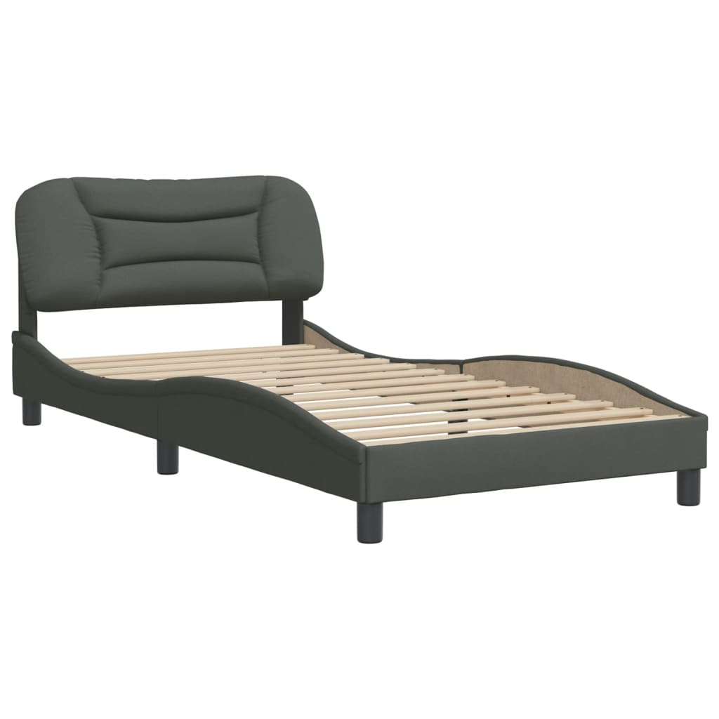 Dark grey upholstered twin bed frame with cushioned headboard and white mattress