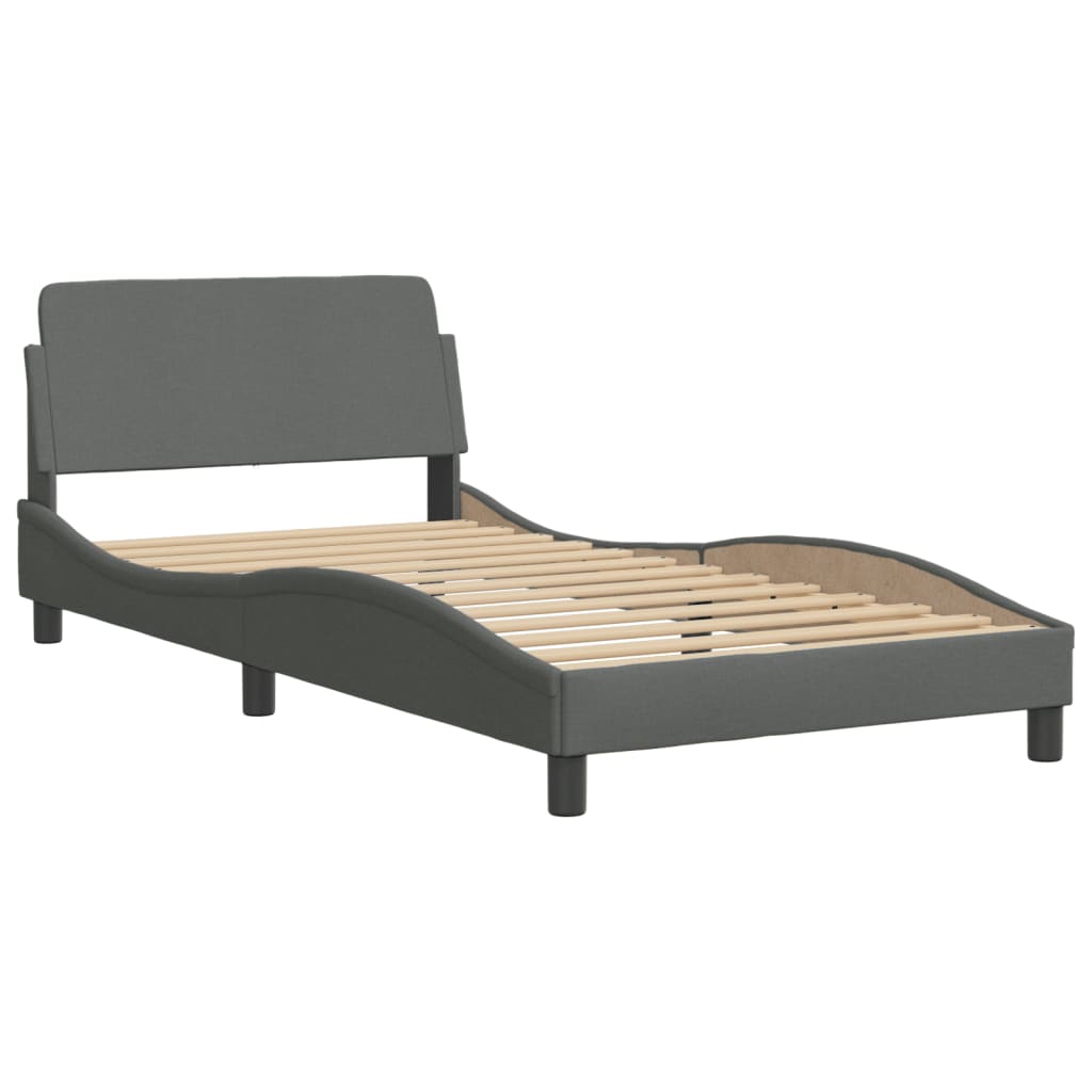 Dark gray upholstered bed frame with a curved headboard and wooden slats