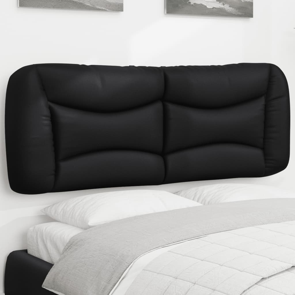 Tufted black faux leather headboard mounted above a bed