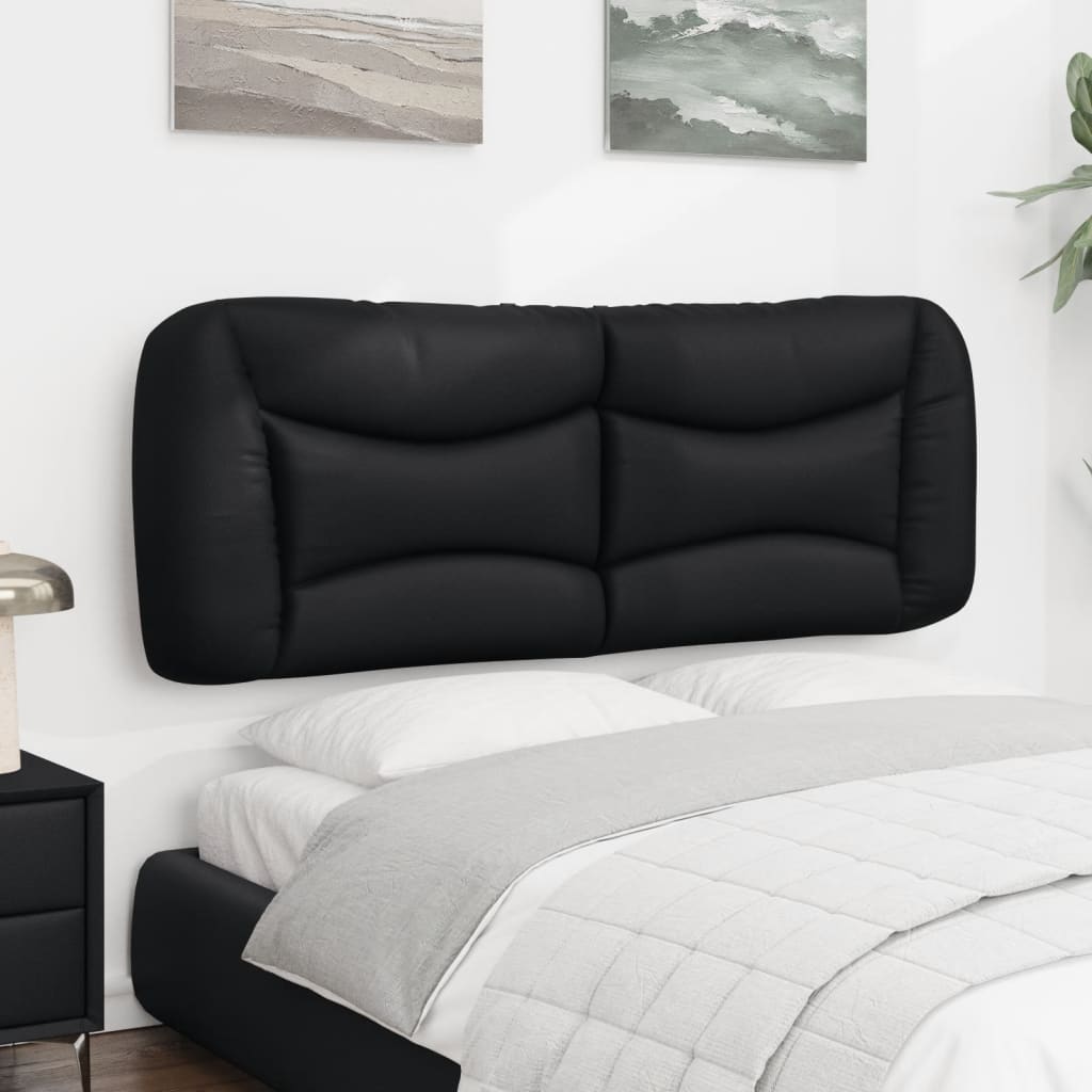 Black leather tufted headboard on a bed frame