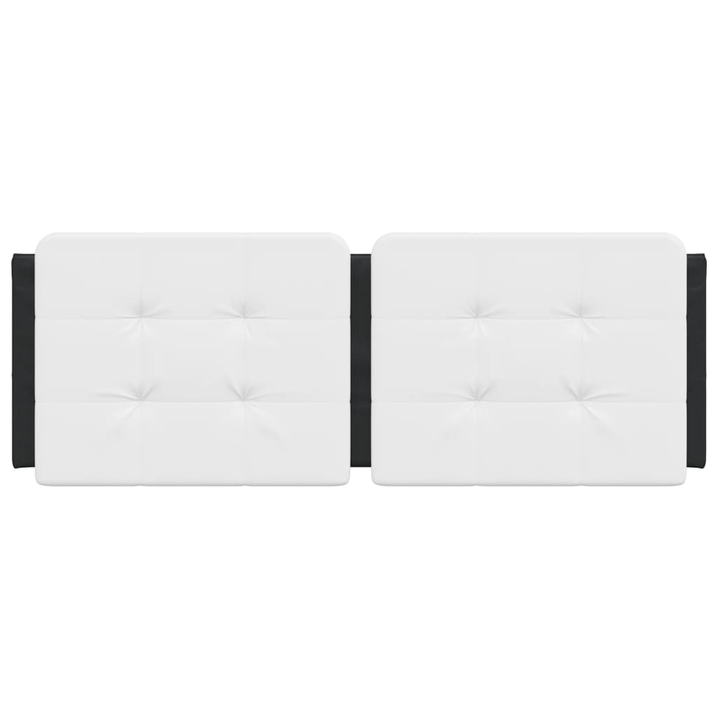 Two tufted white leather headboard panels attached to a wall above a bed