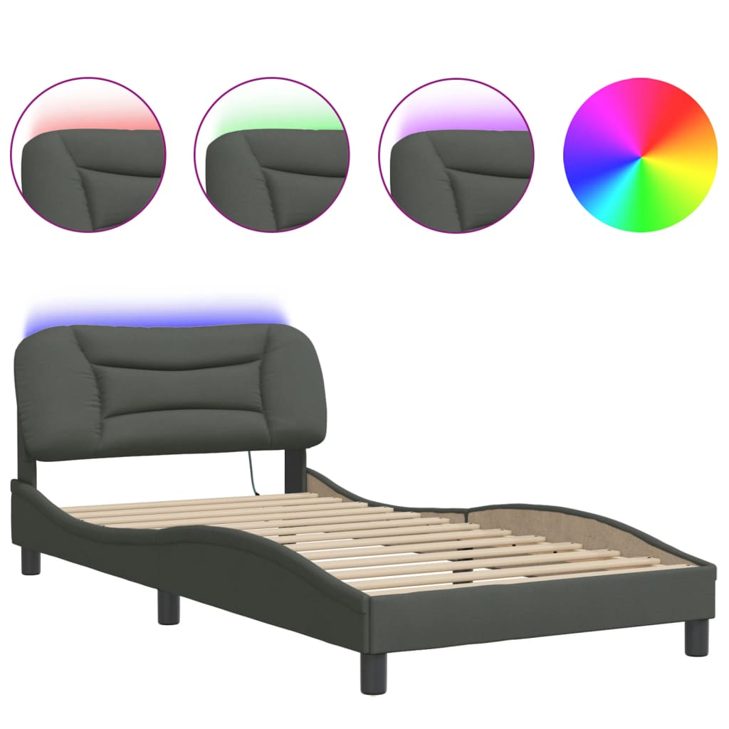 Closeup of a grey upholstered bed frame corner with a black cylindrical leg