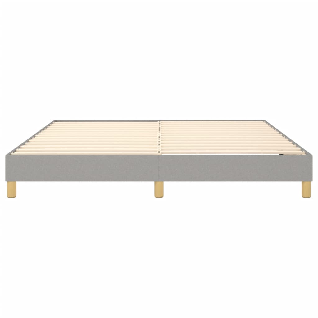 Gray upholstered platform bed frame with wooden slats