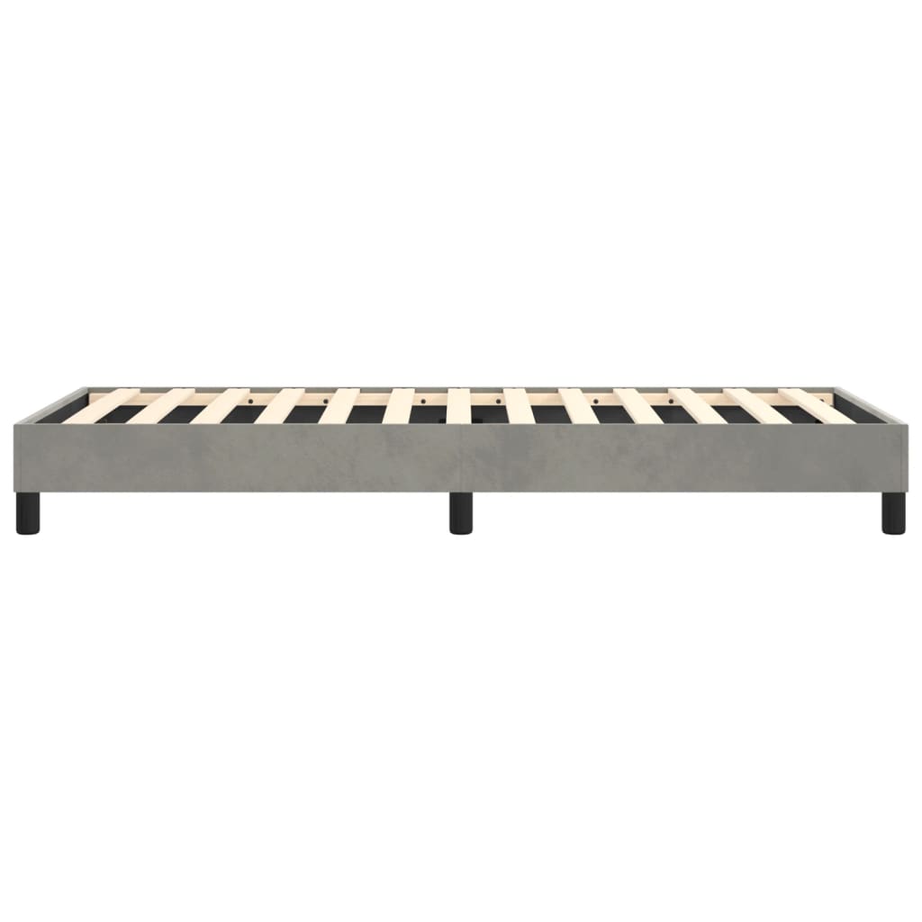 Grey upholstered platform bed frame with wooden slats