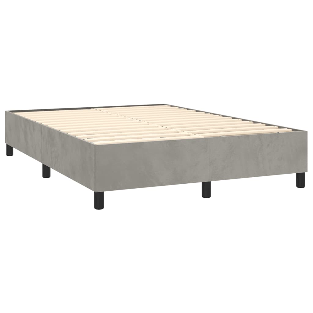 Modern grey upholstered box spring bed frame with white mattress