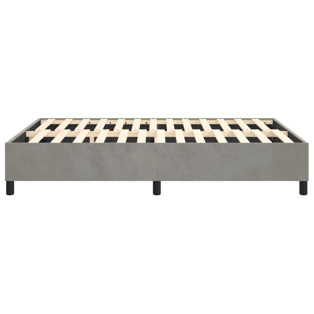Modern grey upholstered bed frame with wooden slats and black legs