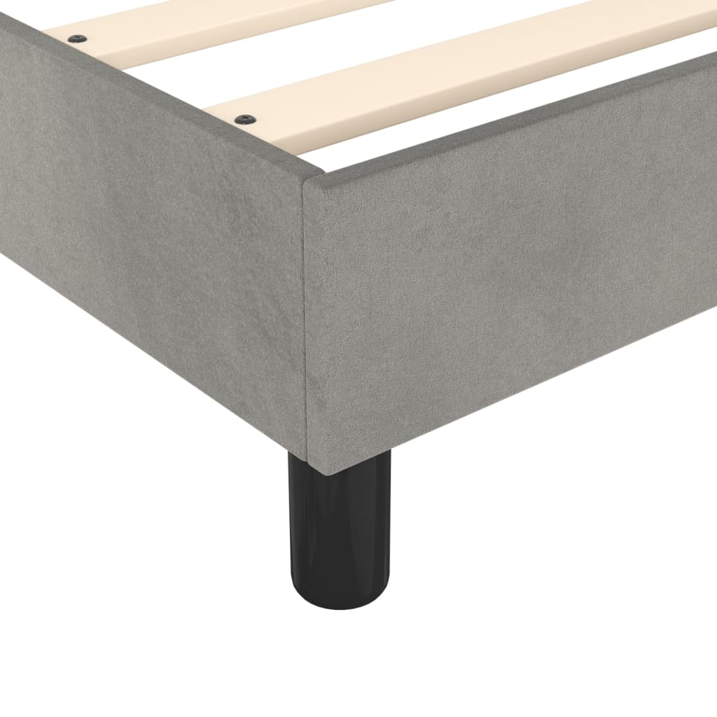 Platform bed frame in grey fabric with wooden slats