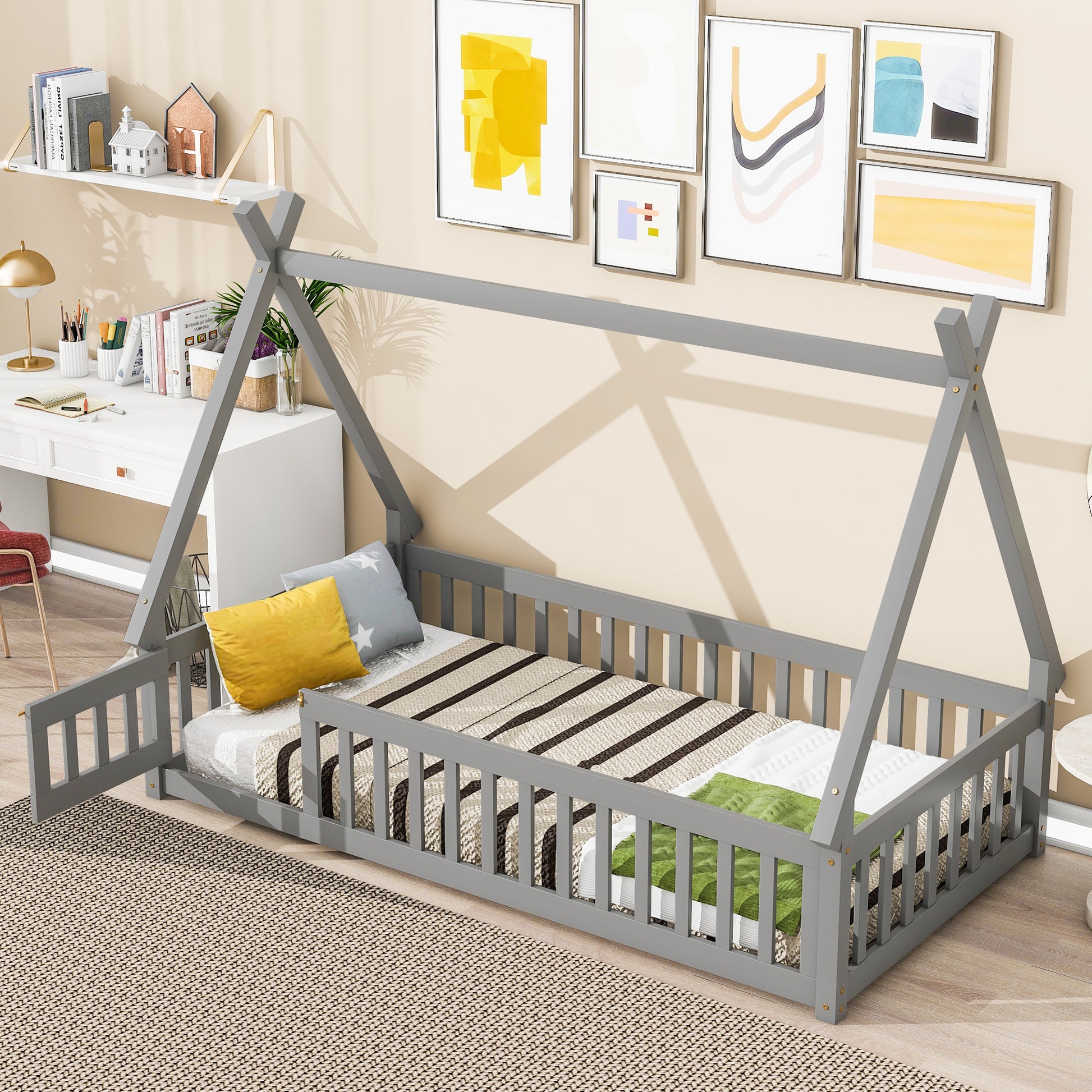 Grey wooden toddler bed frame with guard rails featuring a teepee design and playful bedding
