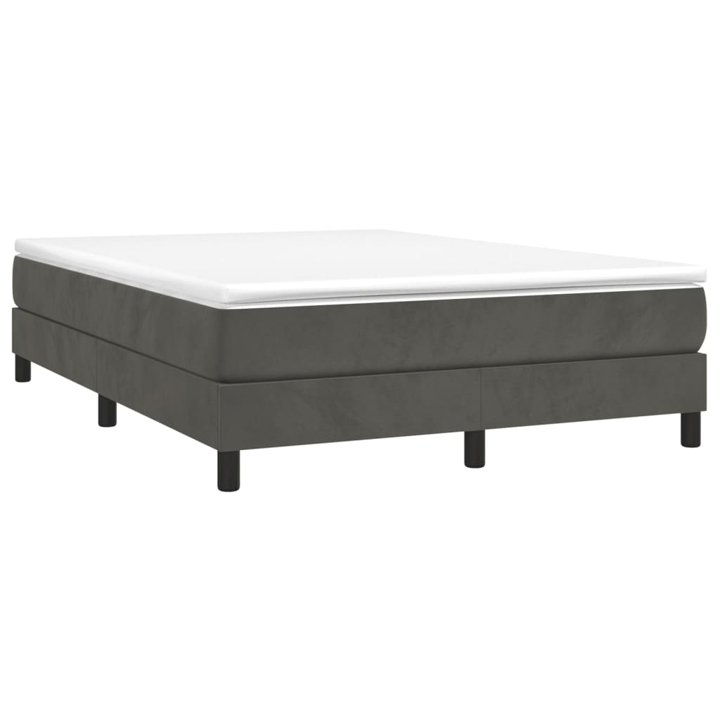 Dark gray upholstered bed frame with a white mattress