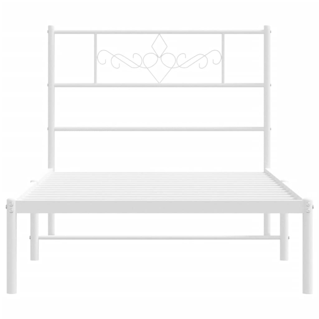 White metal bed frame with ornate headboard detail