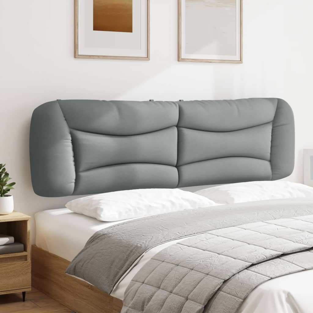 Gray upholstered headboard with curved stitching