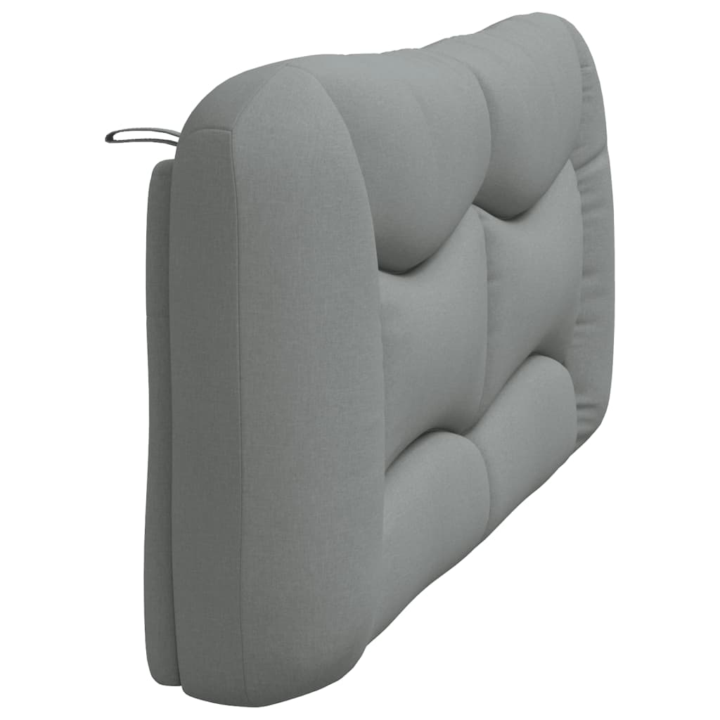 Gray upholstered headboard with curved stitch detailing