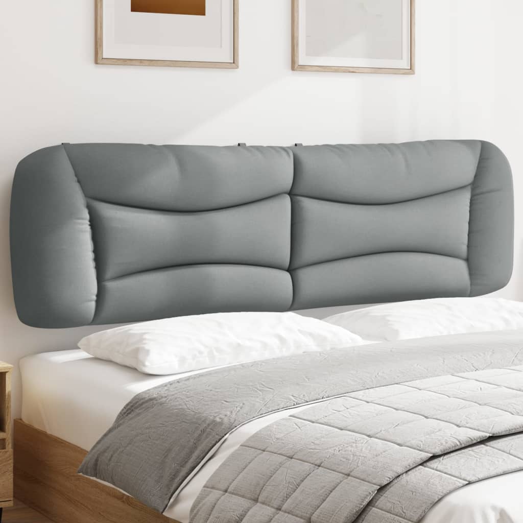 Grey upholstered curved headboard with tufted panels