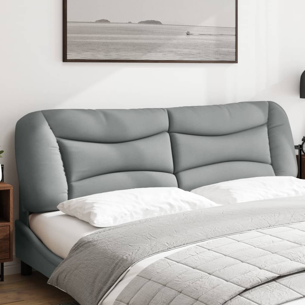 Gray upholstered headboard with tufted detailing