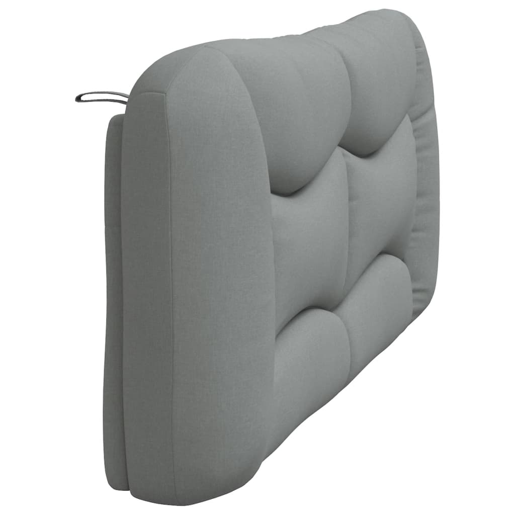 Gray tufted upholstered headboard with curved stitching detail