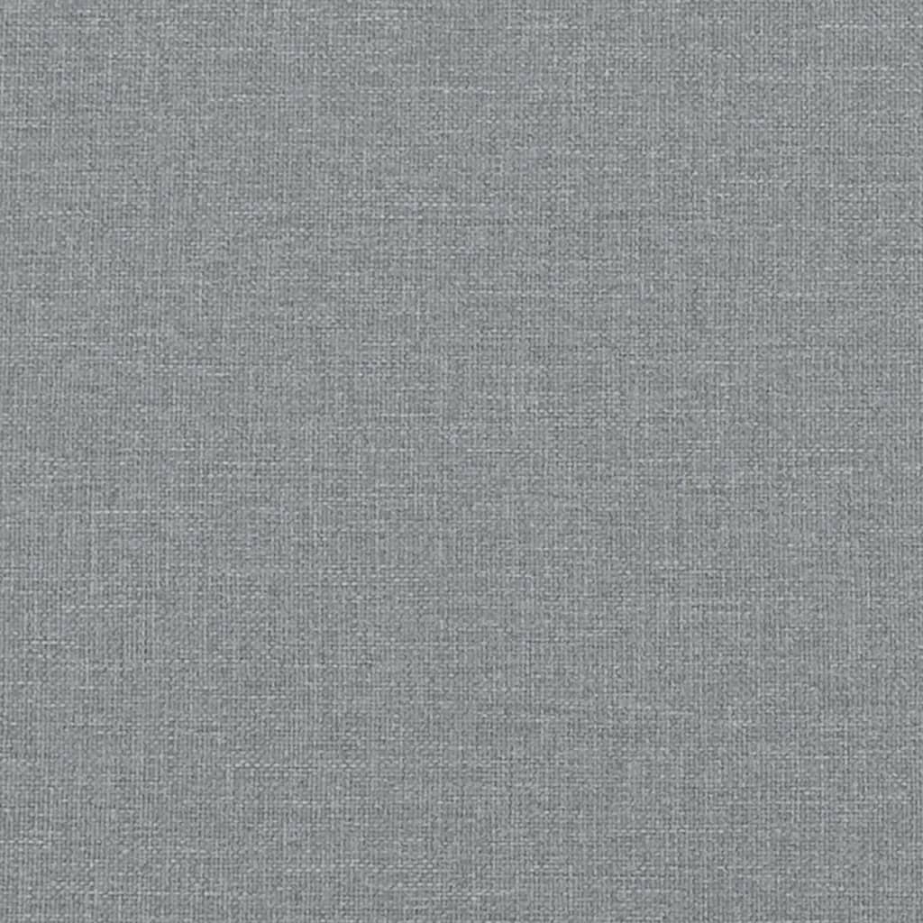 Closeup of plush grey fabric armchair upholstery with deep cushioning