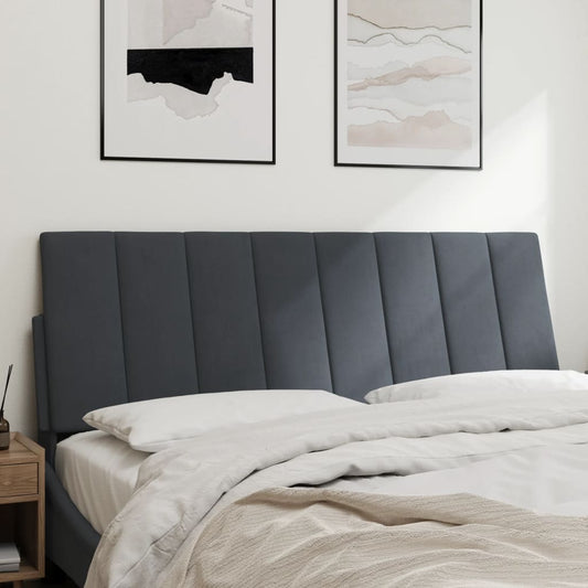 Dark gray upholstered headboard with vertical channel tufting
