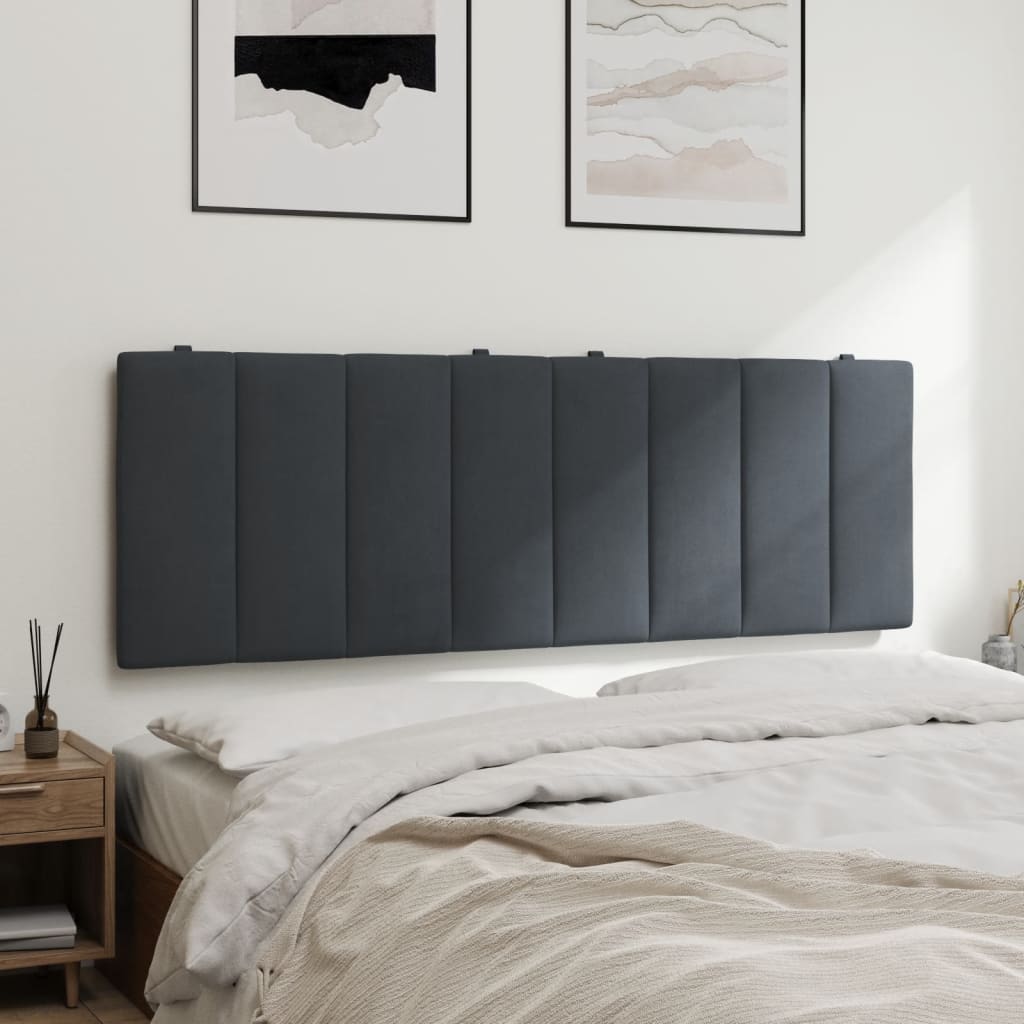 Grey upholstered headboard with vertical tufting