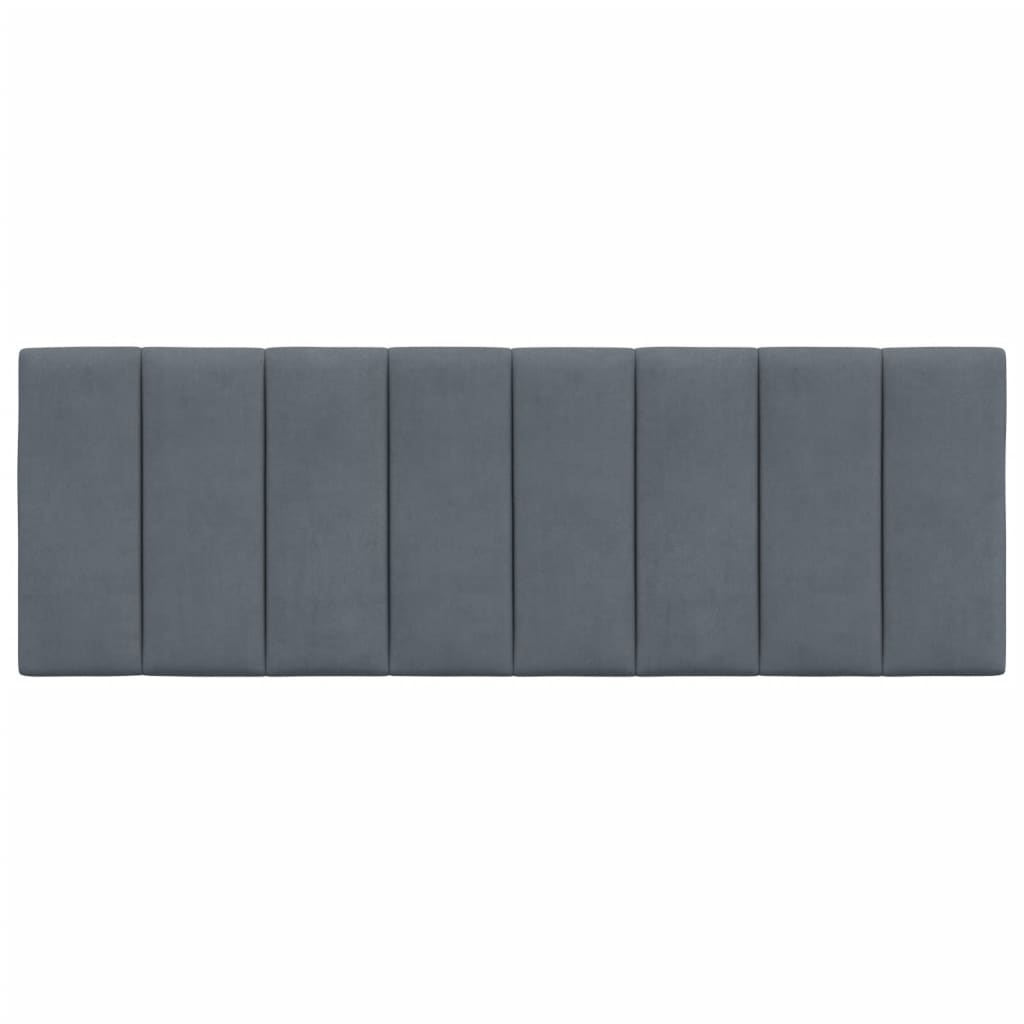 Dark gray upholstered headboard with vertical paneling above a bed