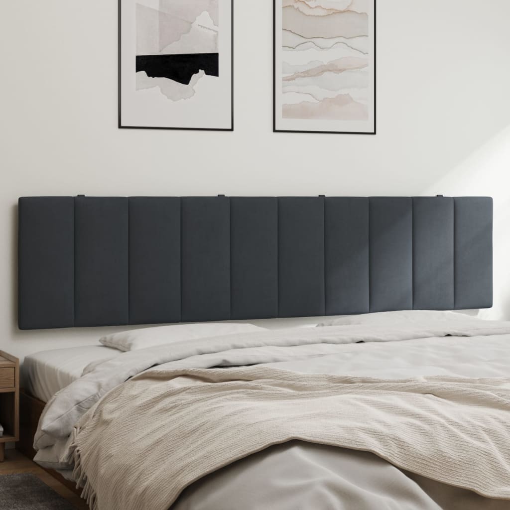 Dark gray upholstered headboard with vertical paneling