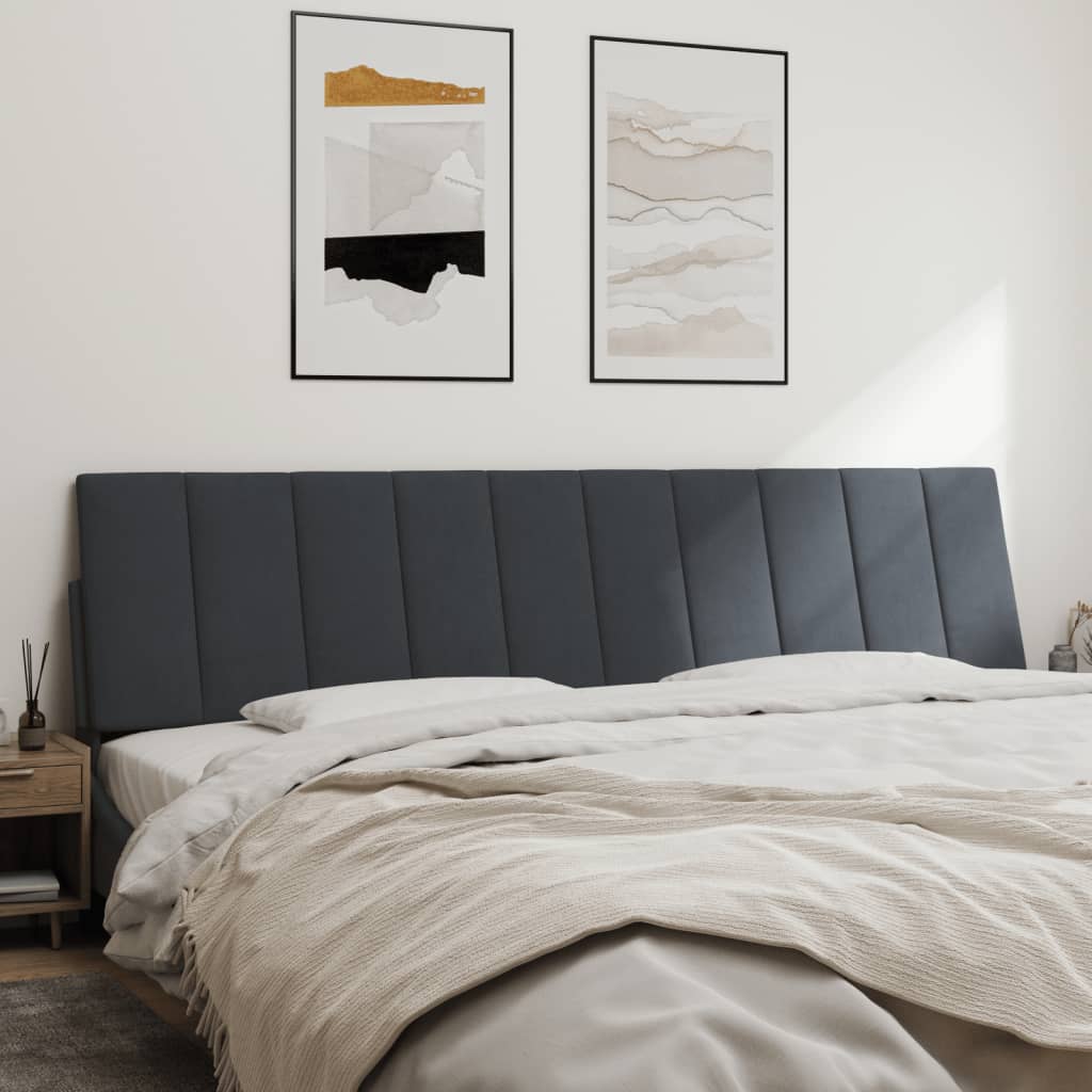 Gray upholstered headboard with vertical channel tufting