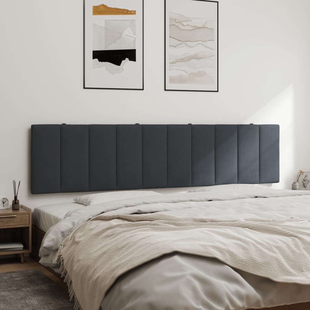 Dark gray upholstered headboard with vertical channel tufting