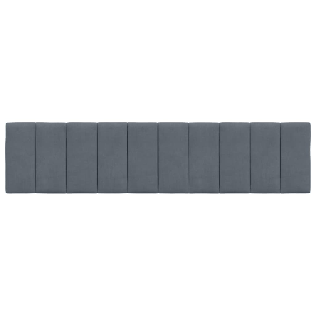 Dark grey upholstered headboard with vertical paneling