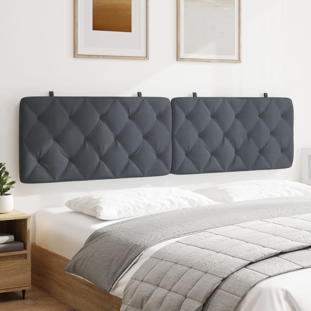 Dark grey tufted headboard on a queen size bed