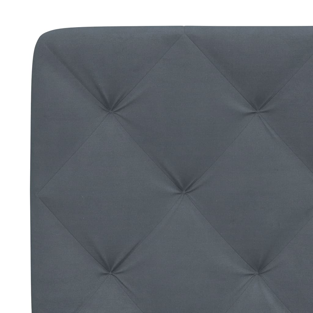 Dark gray fabric bed headboard with tufted detailing