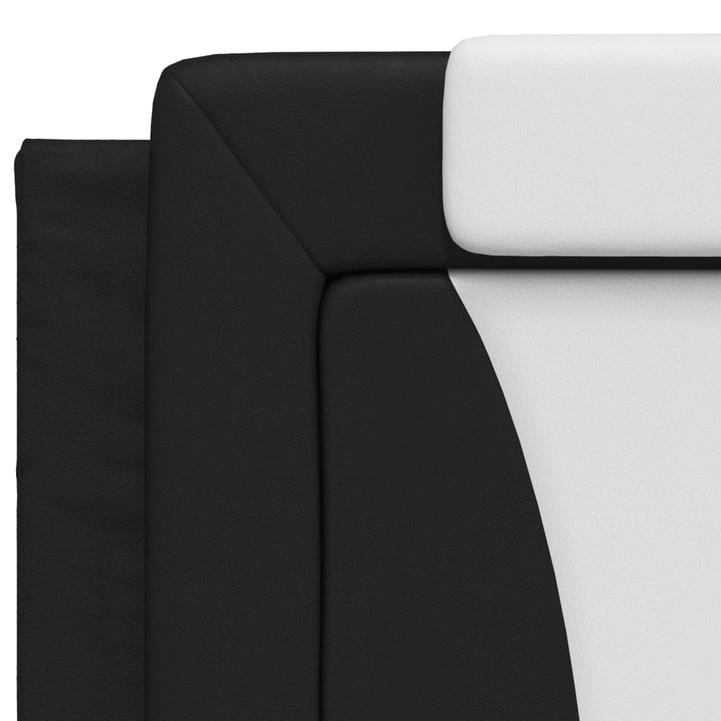 Black upholstered modular sofa with white seat cushions