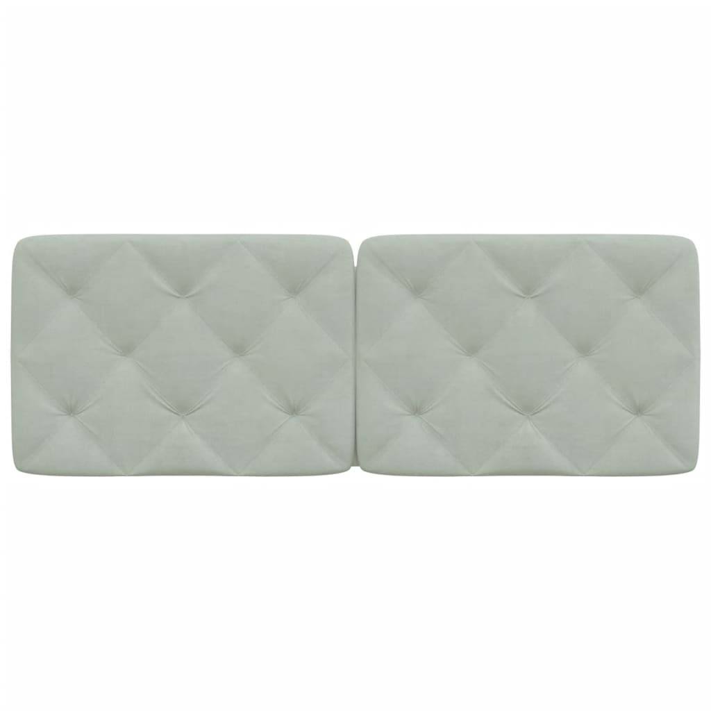 Light grey tufted velvet headboard panels mounted on a wall