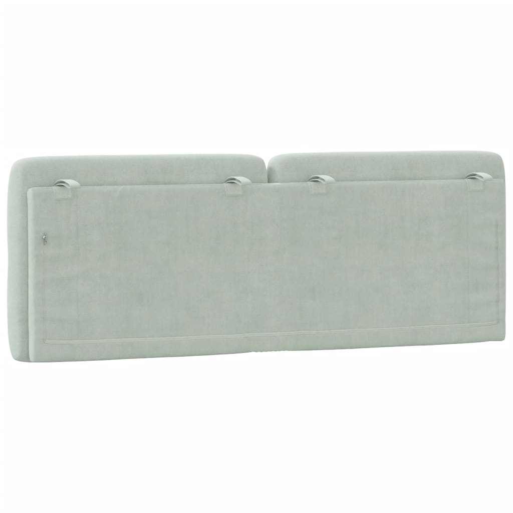Light grey tufted headboard with diamond pattern and a metallic loop accent