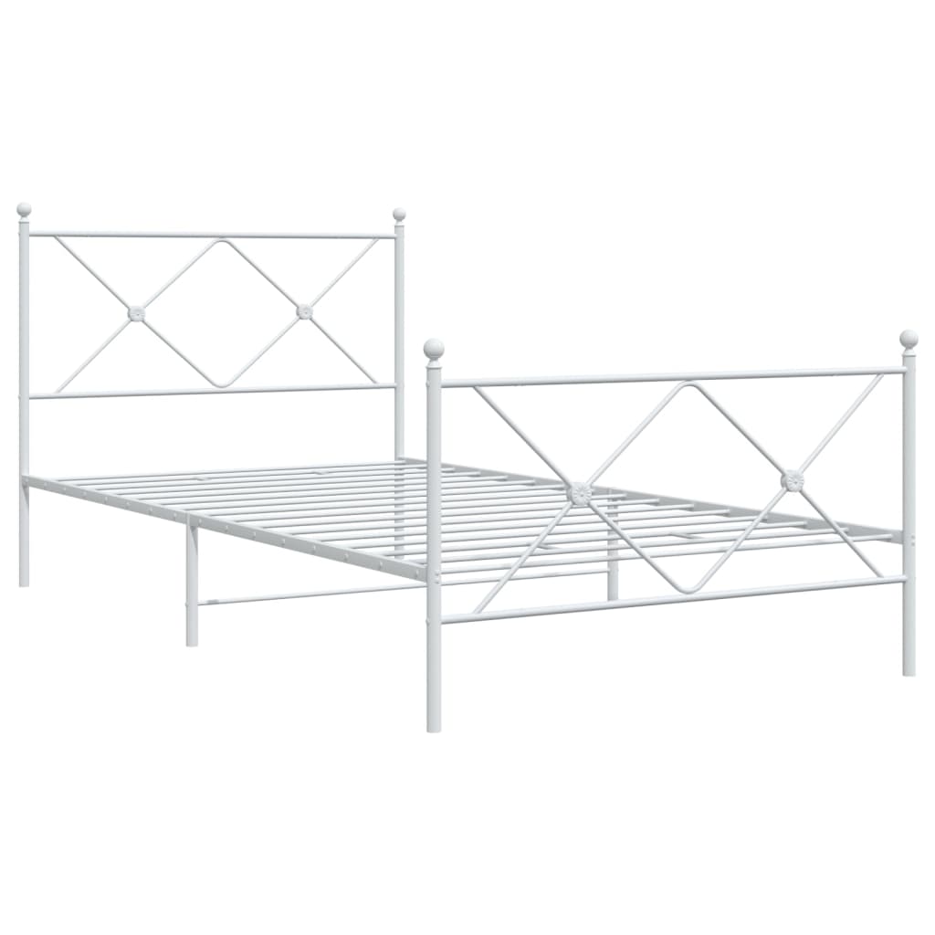 White metal frame bed with diamond pattern detailing and blue bedding