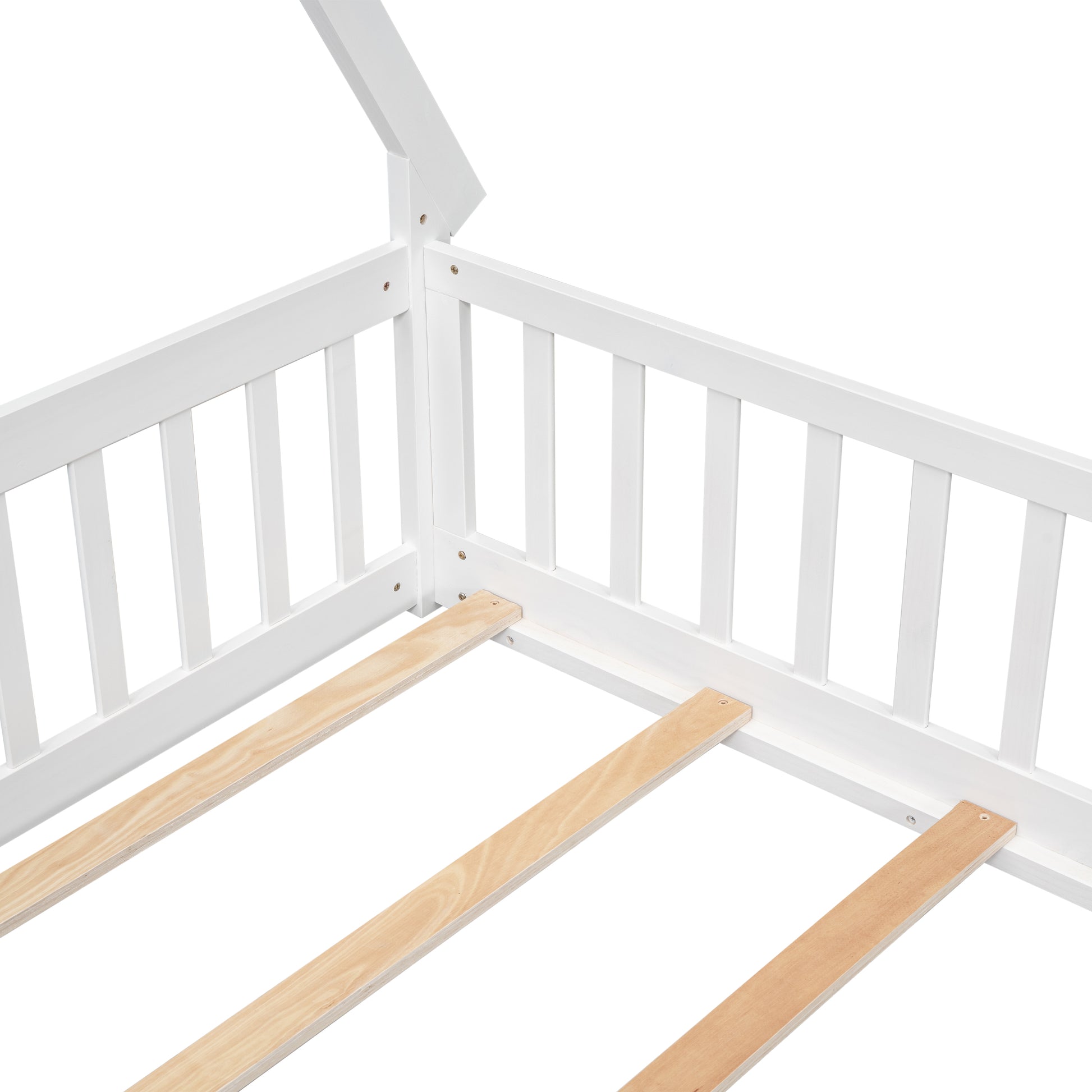 Closeup of a white wooden house bed frame showing slats for mattress support