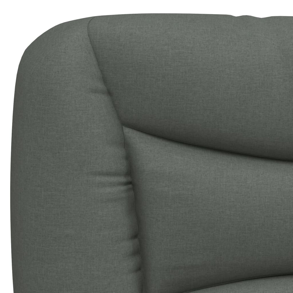 Closeup of upholstered grey fabric bed frame corner with black cylindrical leg
