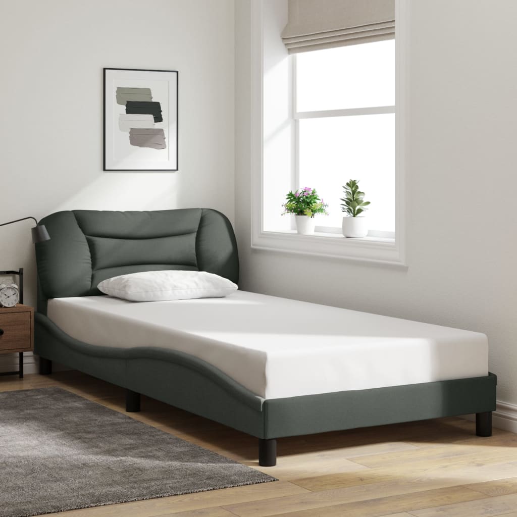Modern upholstered twin bed frame in dark gray with plush headboard
