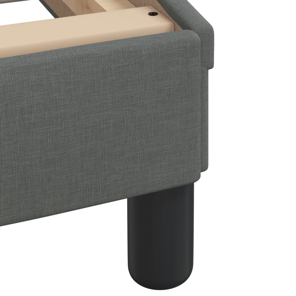 Gray tufted seat cushion with curved edges
