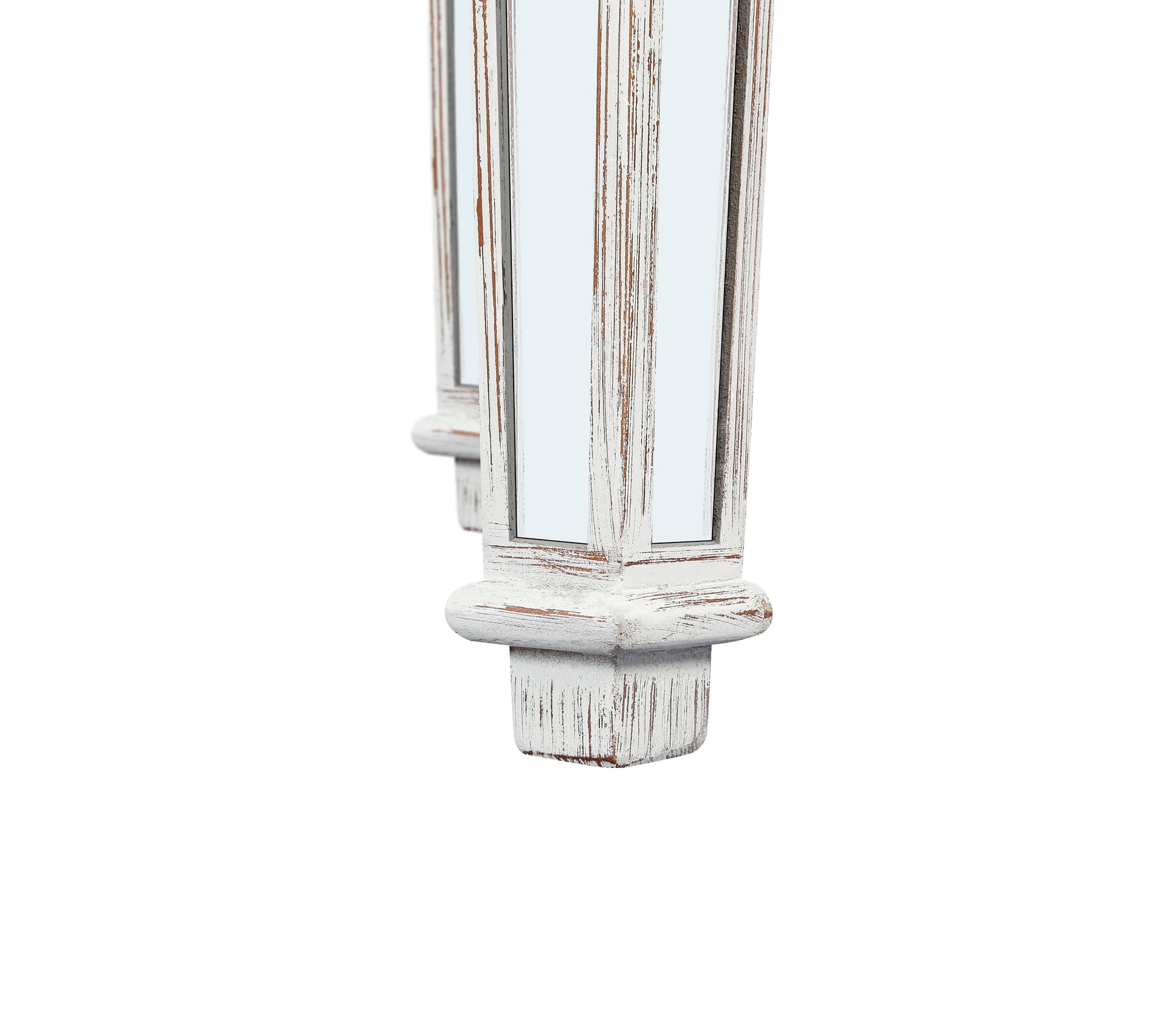 Distressed white wooden legs of a table with mirrored inlays