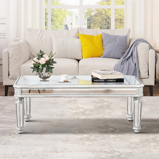 Mirrored coffee table with distressed white finish and ornate detailing